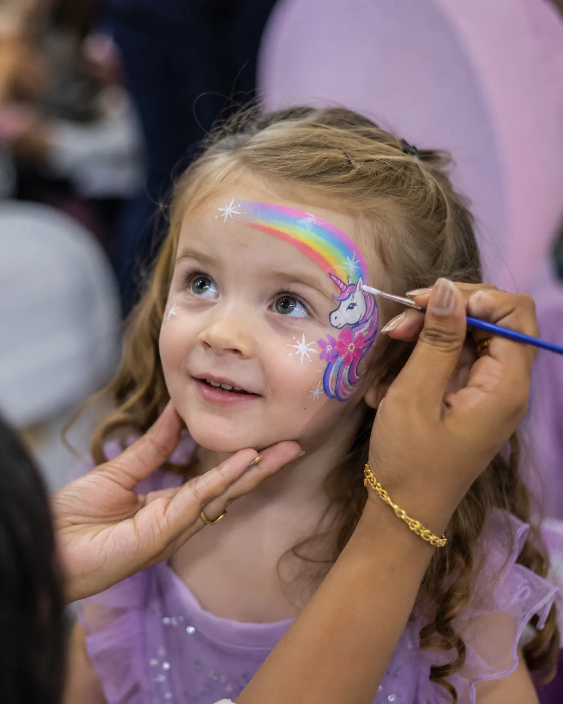 Piya's unicorn face-painting design on a child